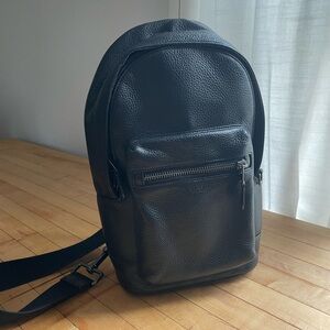 Coach sling backpack men’s unisex pebbled black leather modern